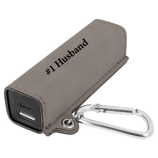 Grey leather power bank with keyring clip and sample engraving
